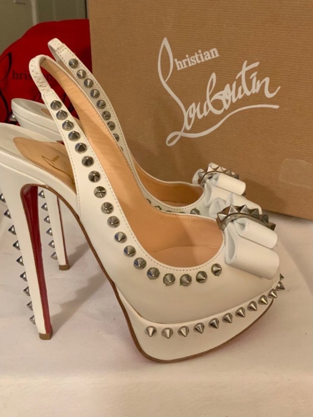 Christian Louboutin womens White Leather Peep-Toe Heels With Spikes & Bow Design